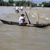 Do mưa lớn gây lũ, nhiều tuyến đường ở tỉnh Bình Định bị ngập sâu. (Ảnh: Trần Lê Lâm/TTXVN)