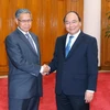 Thủ tướng Nguyễn Xuân Phúc tiếp Bộ trưởng Ngoại thương và Công nghiệp Malaysia Datuk Seri Mustapa Mohamed. (Ảnh:Thống Nhất/TTXVN)