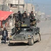 Lực lượng đặc nhiệm Iraq tuần tra tại thành phố Mosul. (Nguồn: AFP/TTXVN)