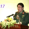 Thượng tướng Lương Cường phát biểu tại buổi gặp mặt. (Ảnh: An Đăng/TTXVN)
