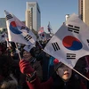 Những người ủng hộ Tổng thống bị luận tội Park Geun-Hye tuần hành tại Seoul. (Nguồn: AFP/TTXVN)