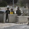Binh sỹ Israel gác tại thành phố Hebron, Khu Bờ Tây. (Nguồn: EPA/TTXVN)