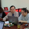 Ông Nguyễn Văn Lạng, Trưởng Văn phòng Thừa phát lại Ba Đình, trả lời ý kiến người dân. (Ảnh: Thanh Huyền/TTXVN)