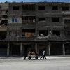 Cảnh yên bình trên một con phố ở Douma, ngoại ô phía Đông thủ đô Damascus sau khi thỏa thuận thiết lập vùng an toàn có hiệu lực. (Nguồn: AFP/TTXVN)