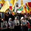 Tuần hành tại thành phố Ramallah, bày tỏ ủng hộ đối với các tù nhân Palestine tuyệt thực. (Nguồn: AFP/TTXVN)