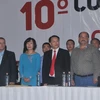 Ông Lê Quang Vĩnh (thứ 4 từ trái sang) dự Đại hội X đảng PT. (Ảnh: Việt Hùng/Vietnam+)
