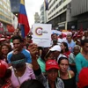 Những người ủng hộ Chính phủ Venezuela tuần hành sau khi chiến dịch tranh cử vào Quốc hội lập hiến được khởi động ở Caracas. (Nguồn: THX/TTXVN)
