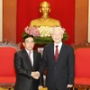 Tổng Bí thư Nguyễn Phú Trọng tiếp Phó Chủ tịch nước Lào Phankham Viphavan. (Ảnh : Trí Dũng/TTXVN)