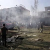 Lực lượng an ninh Afghanistan điều tra tại hiện trường vụ nổ bom ở phía tây Kabul. (Nguồn: EPA/TTXVN)