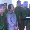 Bị cáo Lê Chí Nguyện nghe Hội đồng xết xử tuyên án. (Ảnh: Huỳnh Sử/TTXVN)