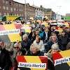 Những người ủng hộ Thủ tướng Angela Merkel tại cuộc vận động tranh cử của đương kim Thủ tướng ở Kappeln, miền Bắc Đức. (Nguồn: AFP/TTXVN)
