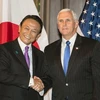 Phó Thủ tướng Nhật Bản Taro Aso (trái) và Phó Tổng thống Mỹ Mike Pence (phải) tại vòng đối thoại ở Washington. (Nguồn: Kyodo/TTXVN)
