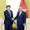 Thủ tướng Nguyễn Xuân Phúc tiếp ông Lý Khánh Khôi, Chủ tịch Tập đoàn Lưới điện Phương Nam (Trung Quốc). (Nguồn: TTXVN)
