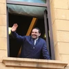 Thủ tướng Liban Saad al-Hariri vẫy chào người ủng hộ tại Beirut. (Nguồn: THX/TTXVN)