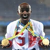 Vận động viên Mo Farah sau khi nhận Huy chương Vàng cự li chạy 5.000m nam tại Olympic Rio de Janeiro 2016. (Nguồn: AFP/TTXVN)