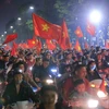 Không khí ăn mừng chiến thắng của đội tuyển U23 Việt Nam tại Hà Nội. (Ảnh: Trọng Đạt/TTXVN)