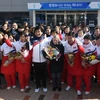 Các vận động viên đội khúc côn cầu trên băng Hàn Quốc và Triều Tiên chụp ảnh chung tại trung tâm huấn luyện quốc gia ở Jincheon, cách Seoul (Hàn Quốc) khoảng 90km về phía Nam. (Nguồn: YONHAP/TTXVN)