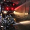 Diễn tập chữa cháy và cứu nạn cứu hộ trong hầm Đèo Cả. (Ảnh: Thế Lập/TTXVN)