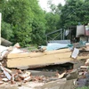 Nhiều công trình bị sụt lún, sập đổ do sạt lở tại xã Tân An, huyện Vĩnh Cửu. (Ảnh: Sỹ Tuyên/TTXVN)