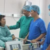 Bệnh nhân Lý Ngọc Tuyết đang được điều trị phục hồi chức năng sau ca mổ tim hở tại Bệnh viện đa khoa Đồng Nai. (Ảnh: Lê Xuân/TTXVN)