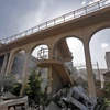 Cảnh đổ nát tại tòa nhà của Trung tâm nghiên cứu khoa học Syria ở quận Barzeh, phía Bắc Damascus. (Nguồn: AFP/TTXVN)