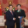 Phó Chủ tịch Thường trực Quốc hội Tòng Thị Phóng tiếp Phó Chủ tịch Quốc hội Lào Somphanh Phengkhammy. (Ảnh: Phương Hoa/TTXVN)