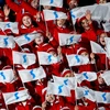Đoàn cổ vũ Triều Tiên vẫy cờ thống nhất Triều Tiên tại lễ khai mạc Olympic PyeongChang 2018. (Nguồn: AFP/TTXVN)