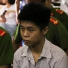 Bị cáo Nguyễn Hữu Tình tại phiên tòa. (Ảnh: Thành Chung/TXVN)