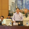 Chủ nhiệm Ủy ban Khoa học, Công nghệ và Môi trường của Quốc hội Phan Xuân Dũng trình bày báo cáo. (Ảnh: Dương Giang/TTXVN)