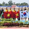 Đội đua thuyền Rowing bốn nữ Việt Nam giành Huy chương Vàng nội dung thuyền bốn nữ hạng nhẹ tại ASIAD 2018. (Nguồn: AFP/TTXVN)
