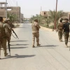 Các lực lượng Iraq trong chiến dịch truy quét IS tại tỉnh Anbar. (Nguồn: AFP/TTXVN)