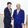 Thủ tướng Nguyễn Xuân Phúc tiếp ông Youn Chul Kim, Chủ tịch Công ty Hanwha Techwin. (Ảnh: Thống Nhất/TTXVN)
