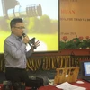 Phó Tổng Giám đốc Thông tấn xã Việt Nam Lê Quốc Minh thuyết trình tại Hội nghị. (Ảnh: Hoa Mai/Vietnam+)