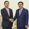 Phó Thủ tướng Vương Đình Huệ tiếp ông Lim Young-jin, Chủ tịch kiêm Tổng Giám đốc Công ty thẻ Shinhan (Hàn Quốc). (Ảnh: Doãn Tấn/TTXVN)