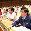 Các đại biểu Quốc hội biểu quyết thông qua Nghị quyết về phân bổ ngân sách trung ương năm 2019. (Ảnh: Văn Điệp/TTXVN)