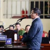 Bị cáo Phan Văn Vĩnh, nguyên Tổng cục trưởng Tổng cục cảnh sát trả lời trước tòa. (Ảnh: Trung Kiên/TTXVN)