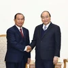 Thủ tướng Nguyễn Xuân Phúc tiếp Bộ trưởng Bộ Tư pháp Lào Xaysy Santivong. (Ảnh: Thống Nhất/TTXVN)
