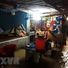 Nhiều ngôi nhà của người dân bị ngập sâu trong nước. (Ảnh: Đỗ Trưởng/TTXVN)