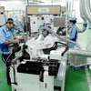 Dây chuyền sản xuất linh kiện cho các sản phẩm điện tử tại Công ty TNHH INOAC Viet Nam (vốn đầu tư của Nhật Bản) tại Khu công nghiệp Quang Minh (Hà Nội). (Ảnh: Danh Lam/TTXVN)