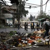 Hiện trường một vụ đánh bom xe tại khu chợ ở thành phố Afrin, Tây Bắc Syria. (Nguồn: AFP/TTXVN)