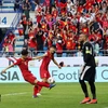 Pha ghi bàn của Công Phượng (thứ 2, trái) vào lưới tuyển Jordan, cân bằng tỷ số 1-1 cho tuyển Việt Nam. (Nguồn: AFP/TTXVN)