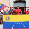 Tổng thống Venezuela Nicolas Maduro (giữa) phát biểu trong cuộc míttinh ủng hộ Chính phủ của ông tại Caracas, Venezuela, ngày 23/1. (Nguồn: THX/TTXVN)