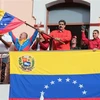 Tổng thống Venezuela Nicolas Maduro (giữa) phát biểu trong cuộc mít tinh ủng hộ Chính phủ của ông tại Caracas, Venezuela. (Nguồn: THX/TTXVN)