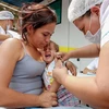 Trẻ em Venezuela tiêm chủng phòng bệnh sởi tại Cucuta, Colombia, gần biên giới với Venezuela. (Nguồn: AFP/TTXVN)