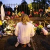 Đặt hoa tưởng niệm các nạn nhân vụ xả súng ở Christchurch, New Zealand. (Nguồn: Kyodo/TTXVN)
