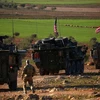Đoàn xe của các lực lượng Mỹ được triển khai tại làng Yalanli, ngoại ô thành phố Manbij, Syria. (Nguồn: AFP/TTXVN)