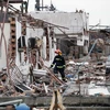 Lực lượng cứu hộ khắc phục hậu quả vụ nổ nhà máy phân bón ở Diêm Thành, Trung Quốc. (Nguồn: THX/TTXVN)