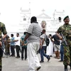 Lực lượng an ninh gác bên ngoài một nhà thờ ở Colombo, Sri Lanka, sau loạt vụ nổ ngày 21/4. (Nguồn: THX/TTXVN)