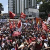 Người dân tuần hành ủng hộ Tổng thống Venezuela Nicolas Maduro tại thủ đô Caracas ngày 6/4. (Nguồn: AFP/TTXVN)
