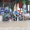 Đường Trường Chinh, thành phố Sơn La bị ngập úng do mưa lớn. (Ảnh: Nguyễn Cường/TTXVN)